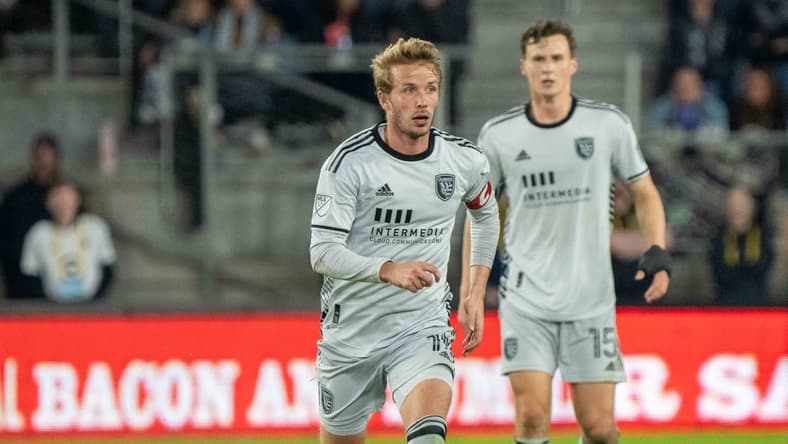Mar 19, 2022; Saint Paul, Minnesota, USA; San Jose Earthquakes midfielder Jackson Yueill (14) moves the ball upfield against Minnesota United in the second half at Allianz Field. Mandatory Credit: Matt Blewett-USA TODAY Sports