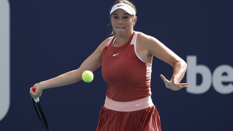 Mar 22, 2022; Miami Gardens, FL, USA; Amanda Anisimova of the United States hits a forehand against Shelby Rogers of the United States (not pictured) in a first round women's singles match in the Miami Open at Hard Rock Stadium. Mandatory Credit: Geoff Burke-USA TODAY Sports