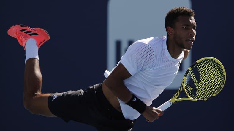 Mar 26, 2022; Miami Gardens, FL, USA; Felix Auger-Aliassime (CAN) serves against Miomir Kecmanovic (SRB)(not pictured) in a second round mens's singles match in the Miami Open at Hard Rock Stadium. Mandatory Credit: Geoff Burke-USA TODAY Sports