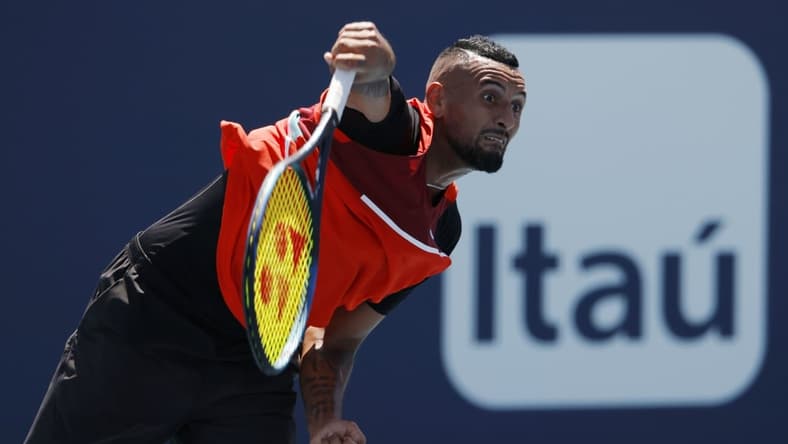 Mar 29, 2022; Miami Gardens, FL, USA; Nick Kyrgios (AUS) serves against Jannik Sinner (ITA)(not pictured) in a fourth round men's singles match in the Miami Open at Hard Rock Stadium. Mandatory Credit: Geoff Burke-USA TODAY Sports