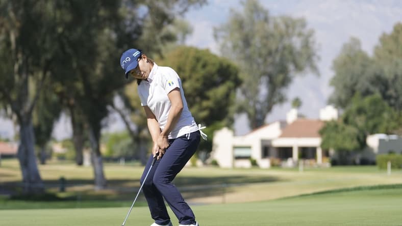 Apr 1, 2022; Rancho Mirage, California, USA; Hinako Shibuno encourages a birdie putt to fall during the second round of the Chevron Championship golf tournament. Mandatory Credit: David Yeazell-USA TODAY Sports