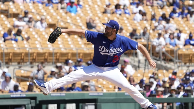 Apr 2, 2022; Phoenix, Arizona, USA; Los Angeles Dodgers starting pitcher Clayton Kershaw (22) throws against the San Francisco Giants during a spring training game at Camelback Ranch-Glendale. Mandatory Credit: Rick Scuteri-USA TODAY Sports