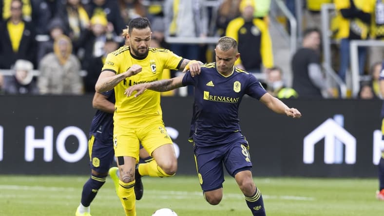 Apr 2, 2022; Columbus, Ohio, USA; Columbus Crew midfielder Artur (8) and Nashville SC midfielder Randall Leal (8) battle for the ball in the first half at Lower.com Field. Mandatory Credit: Greg Bartram-USA TODAY Sports