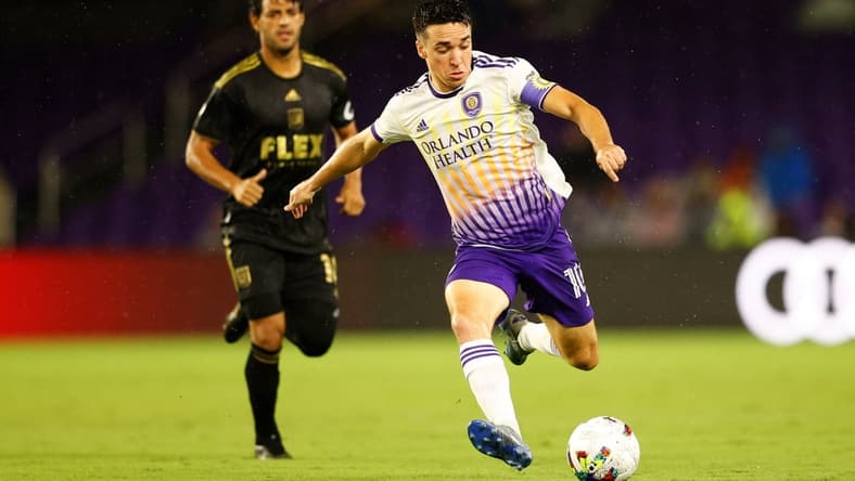 Apr 2, 2022; Orlando, Florida, USA; Orlando City midfielder Mauricio Pereyra (10) looks to shoot the ball against Los Angeles FC in the first half at Orlando City Stadium. Mandatory Credit: Nathan Ray Seebeck-USA TODAY Sports