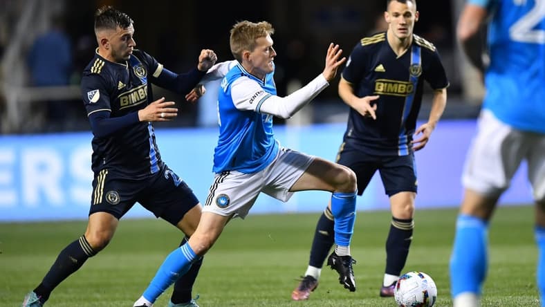 Apr 2, 2022; Philadelphia, Pennsylvania, USA; Charlotte FC forward Karol Swiderski (11) reaches for the ball against Philadelphia Union defender Kai Wagner (27) in the second half at Subaru Park. Mandatory Credit: Kyle Ross-USA TODAY Sports