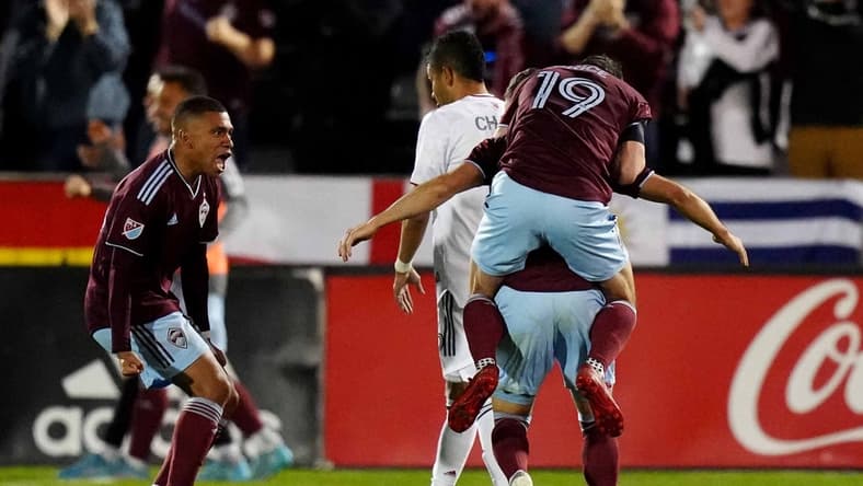 Apr 2, 2022; Commerce City, Colorado, USA; Colorado Rapids defender Lucas Esteves (66) (left), midfielder Jack Price (19) and defender Keegan Rosenberry (2) celebrate a second half goal against Real Salt Lake at Dick's Sporting Goods Park. Mandatory Credit: Ron Chenoy-USA TODAY Sports