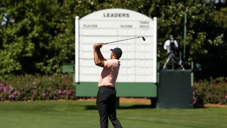 Apr 3, 2022; Augusta, Georgia, USA; Five-time Masters champion Tiger Woods hits balls at the practice facility Sunday afternoon at Augusta National Golf Club. Mandatory Credit: Rob Schumacher-USA TODAY Sports