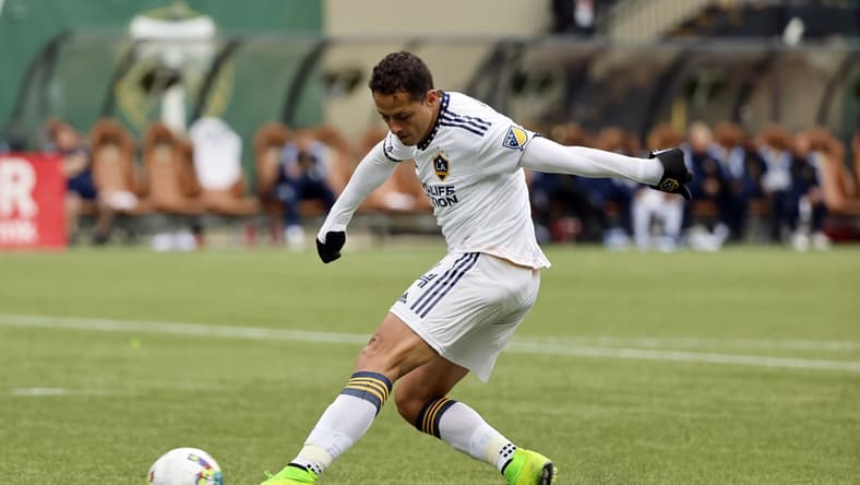 Apr 3, 2022; Portland, Oregon, USA; LA Galaxy forward Javier Hernandez (14) takes a shot on goal during the second half against the Portland Timbers at Providence Park. Mandatory Credit: Soobum Im-USA TODAY Sports