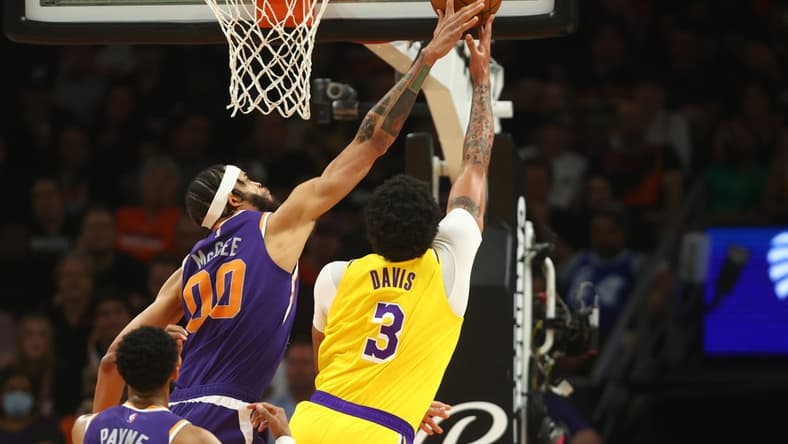 Apr 5, 2022; Phoenix, Arizona, USA; Los Angeles Lakers forward Anthony Davis (3) has his shot blocked by Phoenix Suns center JaVale McGee (00) in the first half at Footprint Center. Mandatory Credit: Mark J. Rebilas-USA TODAY Sports