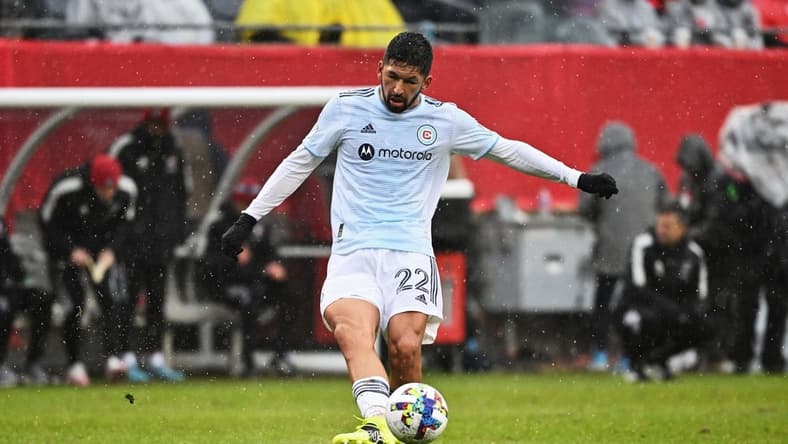 Apr 2, 2022; Chicago, Illinois, USA; Chicago Fire FC defender Mauricio Pineda (22) controls the ball against FC Dallas at Soldier Field. Mandatory Credit: Jamie Sabau-USA TODAY Sports