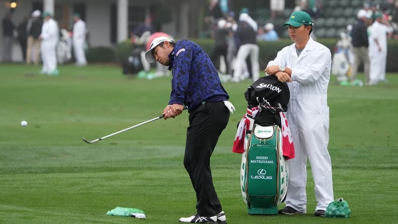 Apr 6, 2022; Augusta, Georgia, USA; Hideki Matsuyama chips balls at the practice facility during a practice round of The Masters golf tournament at Augusta National Golf Club. Mandatory Credit: Kyle Terada-USA TODAY Sports