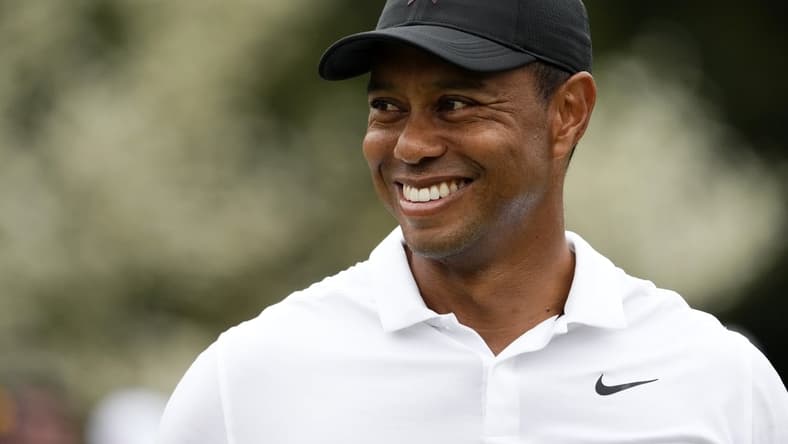Apr 6, 2022; Augusta, Georgia, USA; Tiger Woods smiles at the practice facility during a practice round of The Masters golf tournament at Augusta National Golf Club. Mandatory Credit: Rob Schumacher-USA TODAY Sports