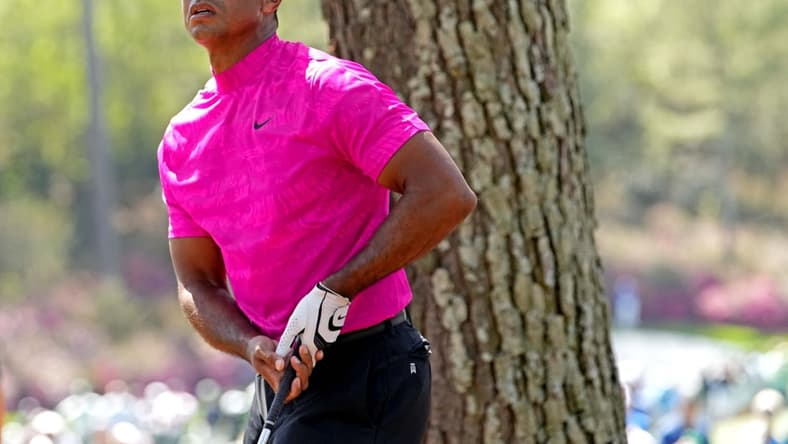 Apr 7, 2022; Augusta, Georgia, USA; Tiger Woods plays from the rough on the 14th hole during the first round of The Masters golf tournament. Mandatory Credit: Rob Schumacher-USA TODAY Sports