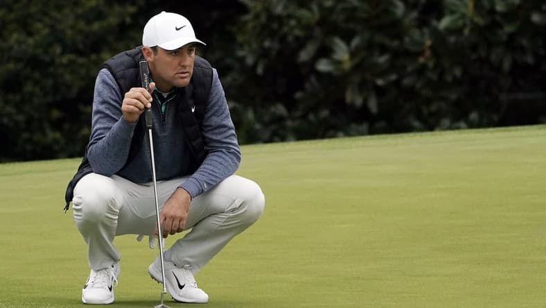 Apr 9, 2022; Augusta, Georgia, USA; Scottie Scheffler lines up a putt on no .5 during the third round of The Masters golf tournament at Augusta National Golf Club. Mandatory Credit: Katie Goodale-Augusta Chronicle/USA TODAY Sports