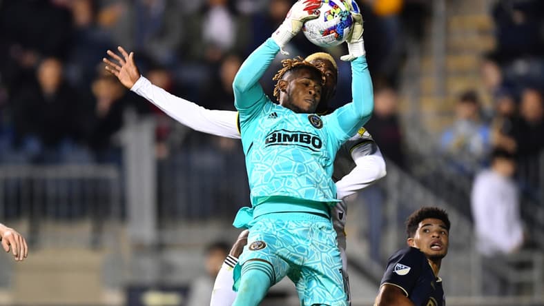 Apr 9, 2022; Philadelphia, Pennsylvania, USA; Philadelphia Union keeper Andre Blake (18) catches the ball in front of Columbus Crew forward Gyasi Zardes (11) in the second half at Subaru Park. Mandatory Credit: Kyle Ross-USA TODAY Sports