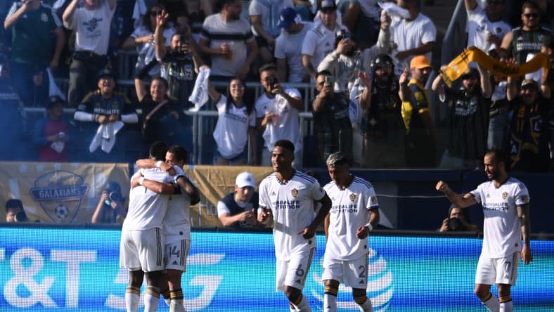Apr 9, 2022; Carson, California, USA; Los Angeles Galaxy defender S ga Coulibaly, left, is embraced by Los Angeles Galaxy forward Javier Hern ndez after Coulibaly s goal in the first half against the Los Angeles FC in their Major League Soccer match at the StubHub Center. Mandatory Credit: Orlando Ramirez-USA TODAY Sports