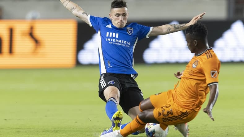 Apr 9, 2022; Houston, Texas, USA; San Jose Earthquakes midfielder Eric Remedi (5) challenges Houston Dynamo forward Carlos Darwin Quintero (23) in the first half at BBVA Compass Stadium. Mandatory Credit: Thomas Shea-USA TODAY Sports