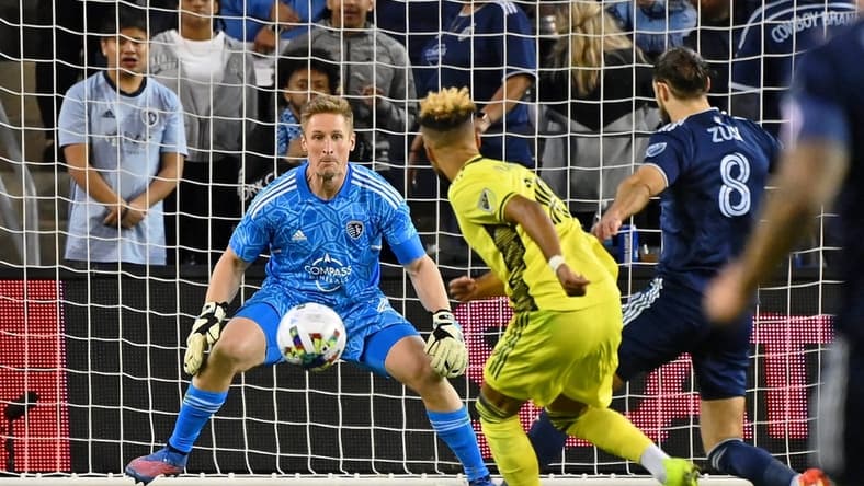 Apr 9, 2022; Kansas City, Kansas, USA; Nashville SC midfielder Hany Mukhtar (10) shoots the ball against Sporting Kansas City goalkeeper Tim Melia (29) during the second half at Children's Mercy Park. Mandatory Credit: Peter Aiken-USA TODAY Sports