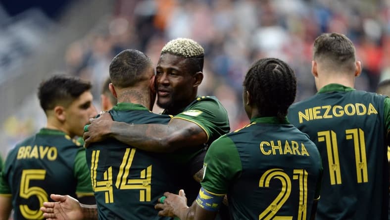 Apr 9, 2022; Vancouver, British Columbia, CAN;  Portland Timbers forward Dairon Asprilla (27) celebrates with teammates after scoring on a penalty kick against the Vancouver Whitecaps during the first half at BC Place. Mandatory Credit: Anne-Marie Sorvin-USA TODAY Sports