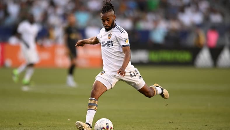 Apr 9, 2022; Carson, California, USA; Los Angeles Galaxy forward Raheem Edwards (44) looks to kick the ball in the second half of their Major League Soccer match against the Los Angeles FC at the StubHub Center. Los Angeles Galaxy won, 2-1. Mandatory Credit: Orlando Ramirez-USA TODAY Sports