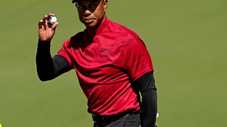 Apr 10, 2022; Augusta, Georgia, USA; Tiger Woods reacts to his putt on the second green during the final round of the Masters golf tournament. Mandatory Credit: Rob Schumacher-USA TODAY Sports