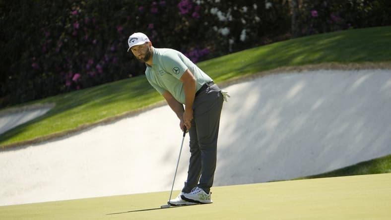 Apr 10, 2022; Augusta, Georgia, USA; Jon Rahm putts on no. 13 during the final round of the Masters Tournament at Augusta National Golf Club. Mandatory Credit: Adam Cairns-Augusta Chronicle/USA TODAY Sports