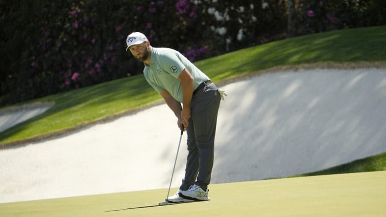 Apr 10, 2022; Augusta, Georgia, USA; Jon Rahm putts on no. 13 during the final round of the Masters Tournament at Augusta National Golf Club. Mandatory Credit: Adam Cairns-Augusta Chronicle/USA TODAY Sports