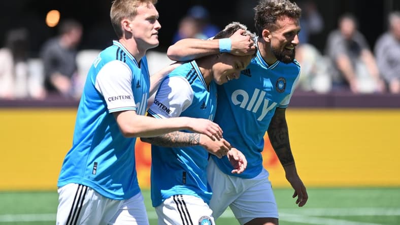 Apr 10, 2022; Charlotte, North Carolina, USA; Charlotte FC midfielder Jordy Alcivar (8) celebrates after scoring a goal against Atlanta United FC with teammates at Bank of America Stadium. Mandatory Credit: Griffin Zetterberg-USA TODAY Sports