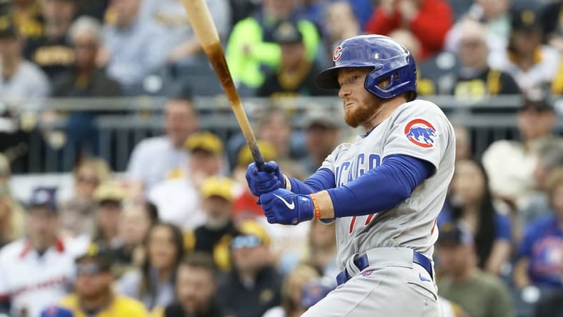 Apr 12, 2022; Pittsburgh, Pennsylvania, USA; Chicago Cubs designated hitter Clint Frazier (77) hits a double against the Pittsburgh Pirates during the sixth inning at PNC Park. Mandatory Credit: Charles LeClaire-USA TODAY Sports