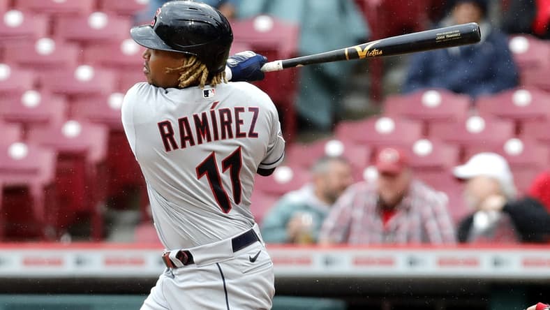 Apr 13, 2022; Cincinnati, Ohio, USA; Cleveland Guardians third baseman Jose Ramirez (11) hits a double against the Cincinnati Reds during the sixth inning at Great American Ball Park. Mandatory Credit: David Kohl-USA TODAY Sports