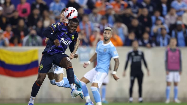 Apr 13, 2022; Harrison, NJ, USA; Seattle Sounders defender Nouhou Tolo (5) heads the ball away during the second half against the New York City FC at Red Bull Arena. Mandatory Credit: Vincent Carchietta-USA TODAY Sports