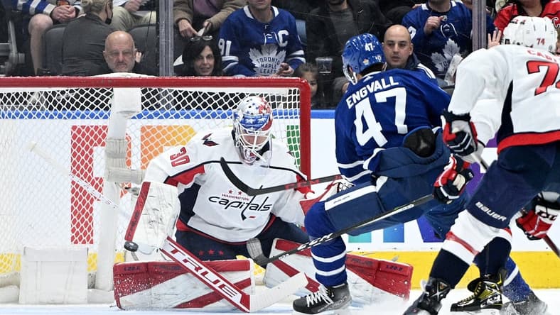 Apr 14, 2022; Toronto, Ontario, CAN; Washington Capitals goalie Ilya Samsonov (30) makes a save on a shot from Toronto Maple Leafs forward Pierre Engvall (47) in the first period at Scotiabank Arena. Mandatory Credit: Dan Hamilton-USA TODAY Sports