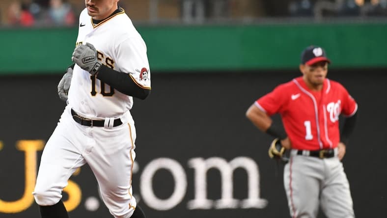 Apr 14, 2022; Pittsburgh, Pennsylvania, USA; Pittsburgh Pirates Bryan Reynolds (10) passes Washington Nationals second baseman Cesar Hernandez (1) after hitting a two-run hiomerun in the third inning against the Washington Nationals at PNC Park. Mandatory Credit: Philip G. Pavely-USA TODAY Sports