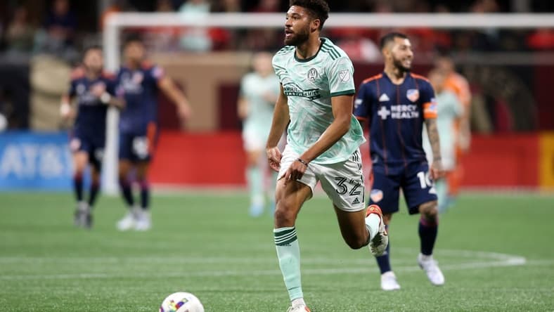 Apr 16, 2022; Atlanta, Georgia, USA; Atlanta United defender George Campbell (32) controls the ball in the first half against the FC Cincinnati at Mercedes-Benz Stadium. Mandatory Credit: Brett Davis-USA TODAY Sports