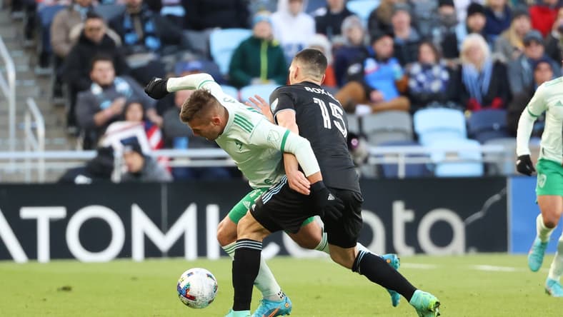 Apr 16, 2022; Saint Paul, Minnesota, USA; Minnesota United defender Michael Boxall (15) and Colorado Rapids forward Diego Rubio (11) battle for the ball during the first half at Allianz Field. Mandatory Credit: Matt Krohn-USA TODAY Sports