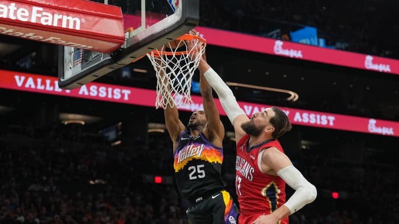 Apr 17, 2022; Phoenix, Arizona, USA; New Orleans Pelicans center Jonas Valanciunas (17) fouls Phoenix Suns forward Mikal Bridges (25) during the second half of game one of the first round for the 2022 NBA playoffs at Footprint Center. Mandatory Credit: Joe Camporeale-USA TODAY Sports