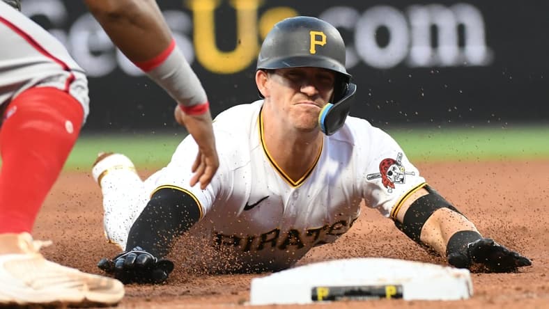 Apr 14, 2022; Pittsburgh, Pennsylvania, USA; Pittsburgh Pirates player Kevin Newman (27) is tagged out trying to get a triple in the third inning by Washington Nationals third baseman Maikel Franco (7) at PNC Park. Mandatory Credit: Philip G. Pavely-USA TODAY Sports