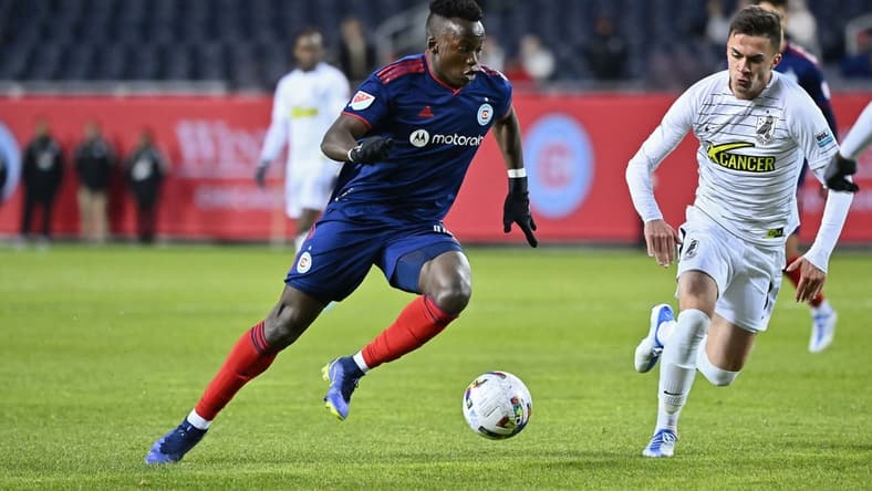Apr 19, 2022; Chicago, Illinois, USA; Chicago Fire FC defender Jhon Espinoza (14) controls the ball against Union Omaha at Soldier Field. Union Omaha defeated Chicago Fire FC on penalty kicks. Mandatory Credit: Jamie Sabau-USA TODAY Sports
