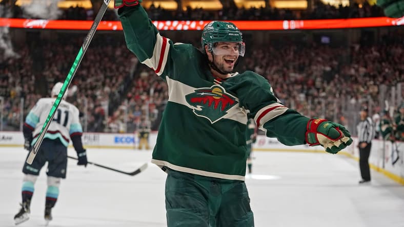 Apr 22, 2022; Saint Paul, Minnesota, USA; Minnesota Wild left wing Kevin Fiala (22) celebrates his fifth assist of the night against the Seattle Kraken on a goal scored by Minnesota Wild forward Nicolas Deslauriers (not pictured) during the second period at Xcel Energy Center. Mandatory Credit: Nick Wosika-USA TODAY Sports