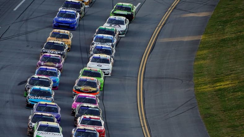 Apr 23, 2022; Talladega, Alabama, USA; NASCAR Xfinity Series driver Justin Allgaier (7) and NASCAR Xfinity Series driver AJ Allmendinger (16) lead the field during the Ag-Pro 300 at Talladega Superspeedway. Mandatory Credit: John David Mercer-USA TODAY Sports