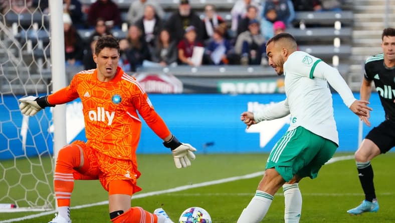 Apr 23, 2022; Commerce City, Colorado, USA; Colorado Rapids forward Andre Shinyashiki (9) kicks the ball at Charlotte FC goalkeeper Kristijan Kahlina (1) in the first half against Charlotte FC at Dick's Sporting Goods Park. Mandatory Credit: Ron Chenoy-USA TODAY Sports