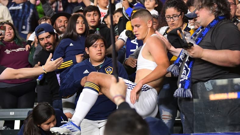 Apr 23, 2022; Carson, California, USA; Los Angeles Galaxy forward Dejan Joveljic (99) tears off his jersey and runs into the stands to celebrate after scoring a goal in the second half against the Nashville SC at Dignity Health Sports Park. Mandatory Credit: Jayne Kamin-Oncea-USA TODAY Sports