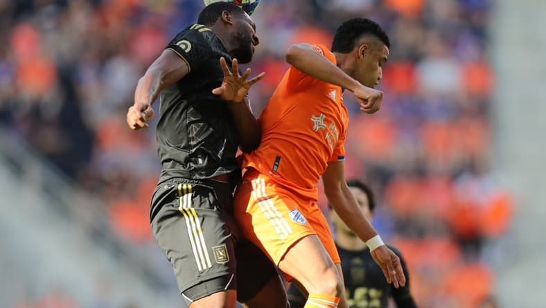 Apr 24, 2022; Cincinnati, Ohio, USA; Los Angeles FC defender Doneil Henry (44) heads the ball out of reach of FC Cincinnati forward Brenner (9) in the first half at TQL Stadium. Mandatory Credit: Katie Stratman-USA TODAY Sports