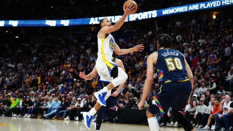 Apr 24, 2022; Denver, Colorado, USA; Golden State Warriors guard Stephen Curry (30) shoots the ball in the second half against the Denver Nuggets of the first round for the 2022 NBA playoffs at Ball Arena. Mandatory Credit: Ron Chenoy-USA TODAY Sports