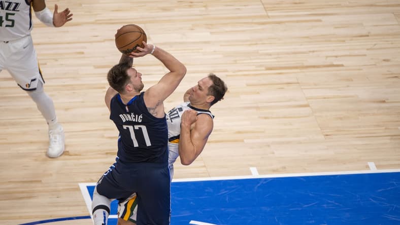 Apr 25, 2022; Dallas, Texas, USA; Dallas Mavericks guard Luka Doncic (77) is fouled by Utah Jazz forward Bojan Bogdanovic (44) during the second quarter in game five of the first round for the 2022 NBA playoffs at American Airlines Center. Mandatory Credit: Jerome Miron-USA TODAY Sports