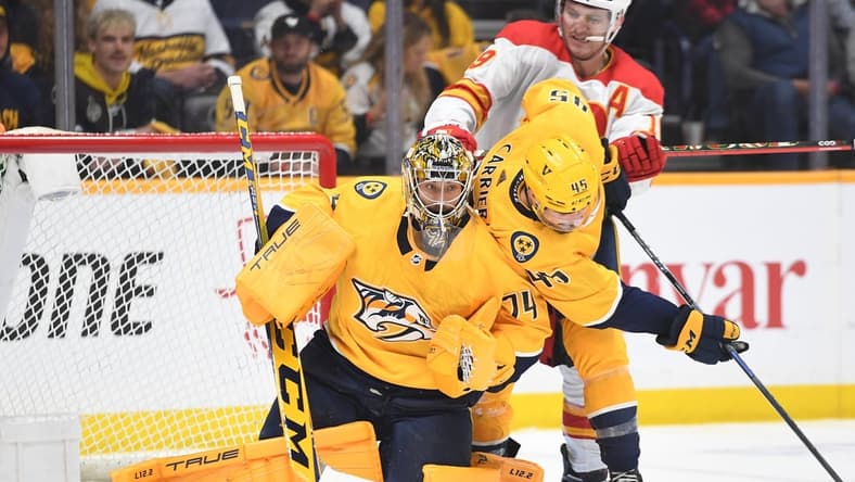 Apr 26, 2022; Nashville, Tennessee, USA; Nashville Predators goaltender Juuse Saros (74) makes a save during the third period against the Calgary Flames at Bridgestone Arena. Mandatory Credit: Christopher Hanewinckel-USA TODAY Sports