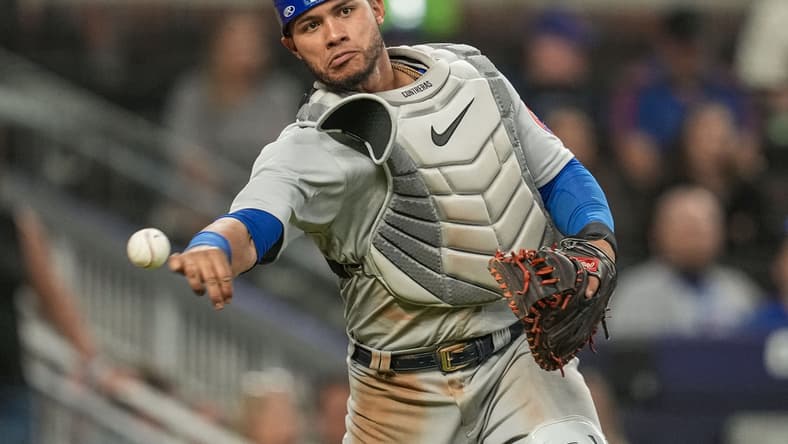 Apr 27, 2022; Cumberland, Georgia, USA; Chicago Cubs catcher Willson Contreras (40) throws out Atlanta Braves first baseman Matt Olson (28) (not shown) after a dropped third strike during the ninth inning at Truist Park. Mandatory Credit: Dale Zanine-USA TODAY Sports