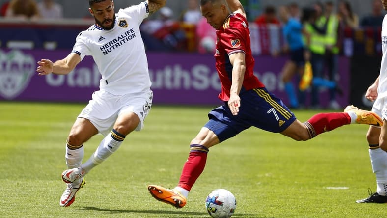 Apr 30, 2022; Sandy, Utah, USA;  Los Angeles Galaxy defender Derrick Williams (3) and Real Salt Lake forward Bobby Wood (7) battle in the first half at Rio Tinto Stadium. Mandatory Credit: Jeffrey Swinger-USA TODAY Sports