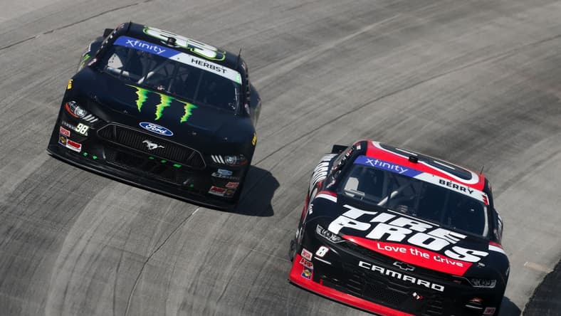 Apr 30, 2022; Dover, Delaware, USA; NASCAR Xfinity Series driver Josh Berry (8) races driver Riley Herbst (98) during the A-Game 200 at Dover Motor Speedway. Mandatory Credit: Matthew OHaren-USA TODAY Sports