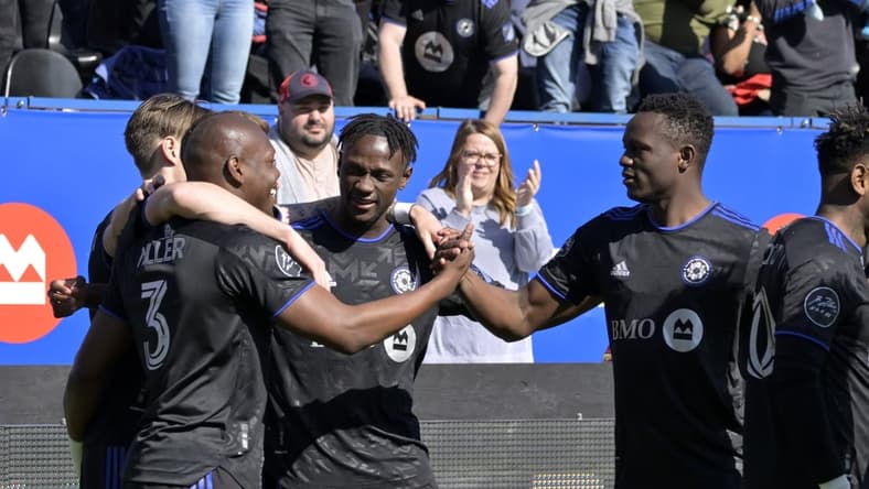 Apr 30, 2022; Montreal, Quebec, CAN; CF Montreal defender Kamal Miller (3) reacts with teammates including midfielder Romell Quioto (30) after scoring a goal against Atlanta United FC during the first half at Stade Saputo. Mandatory Credit: Eric Bolte-USA TODAY Sports